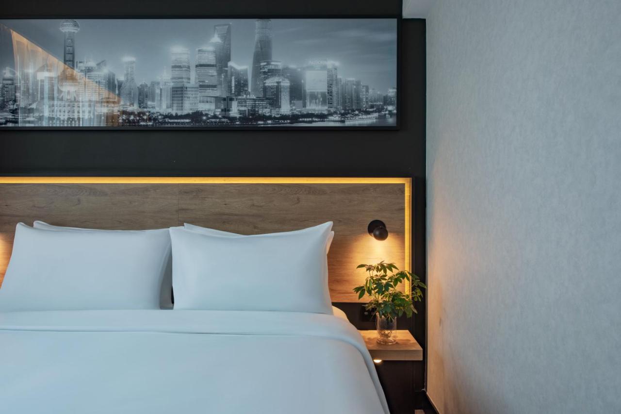 Park Inn By Radisson Shanghai Huanqiugang Exteriör bild